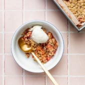 rhubarb crisp in bowl with ice cream