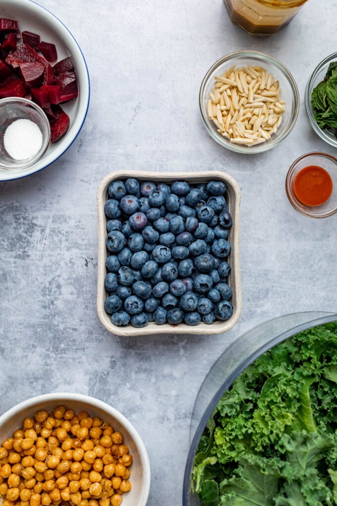 blueberries in box with kale and beets