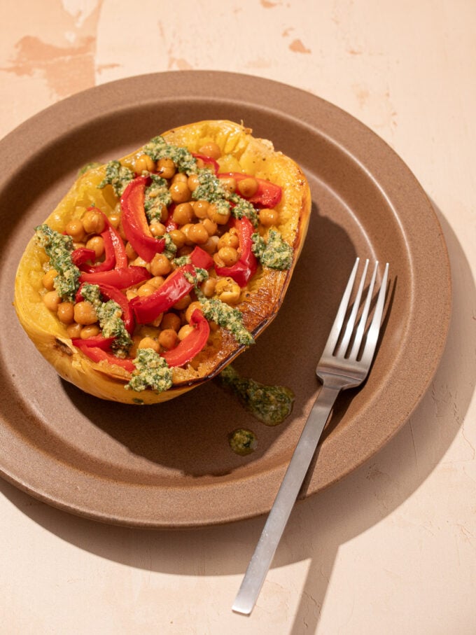 spaghetti squash with peppers and chickpeas on brown plate