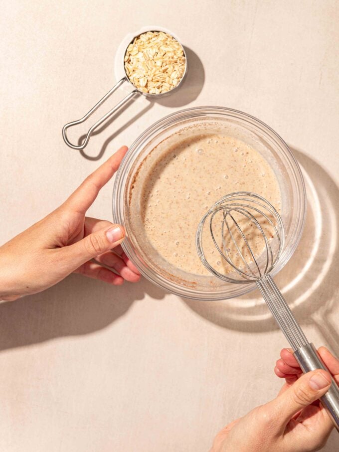 hand whisking bowl with milk