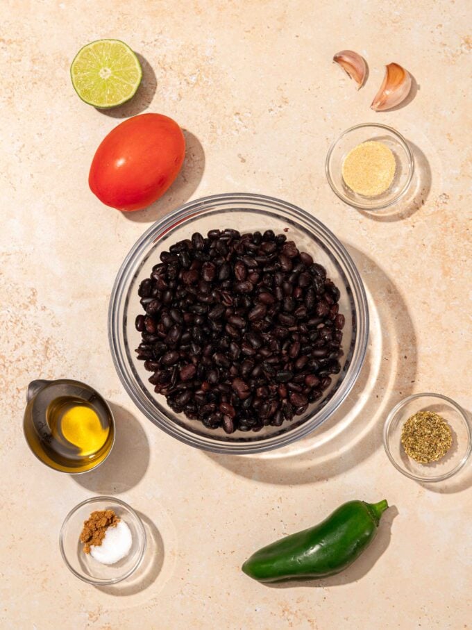 black beans in bowl with tomato and jalapeno