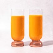 carrot ginger smoothies in glasses