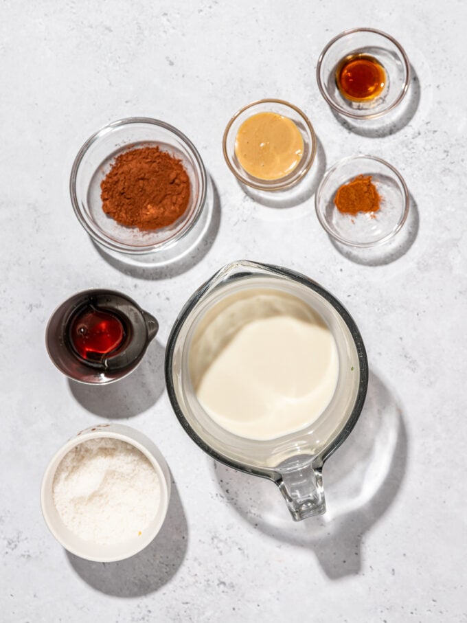 oat milk, cocoa powder in glass bowls