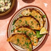 black bean tacos on plate with lime wedges