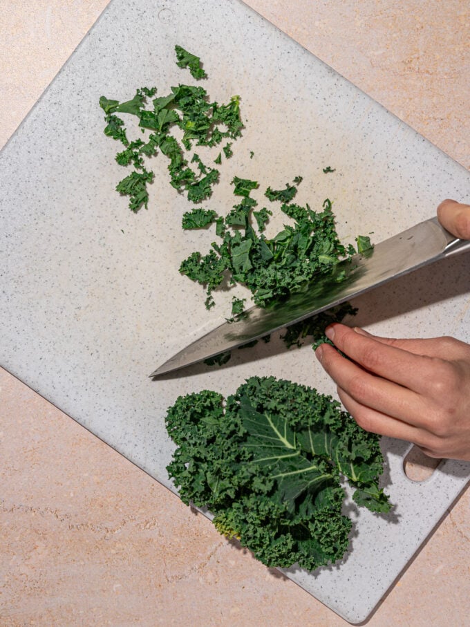 hand chopping kale