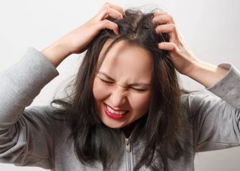 I have a dry scalp. How frequently should I shampoo?