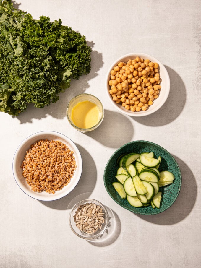 kale, cucumber, farro, chickpeas in bowls