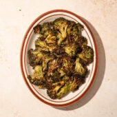 smashed broccoli on brown plate