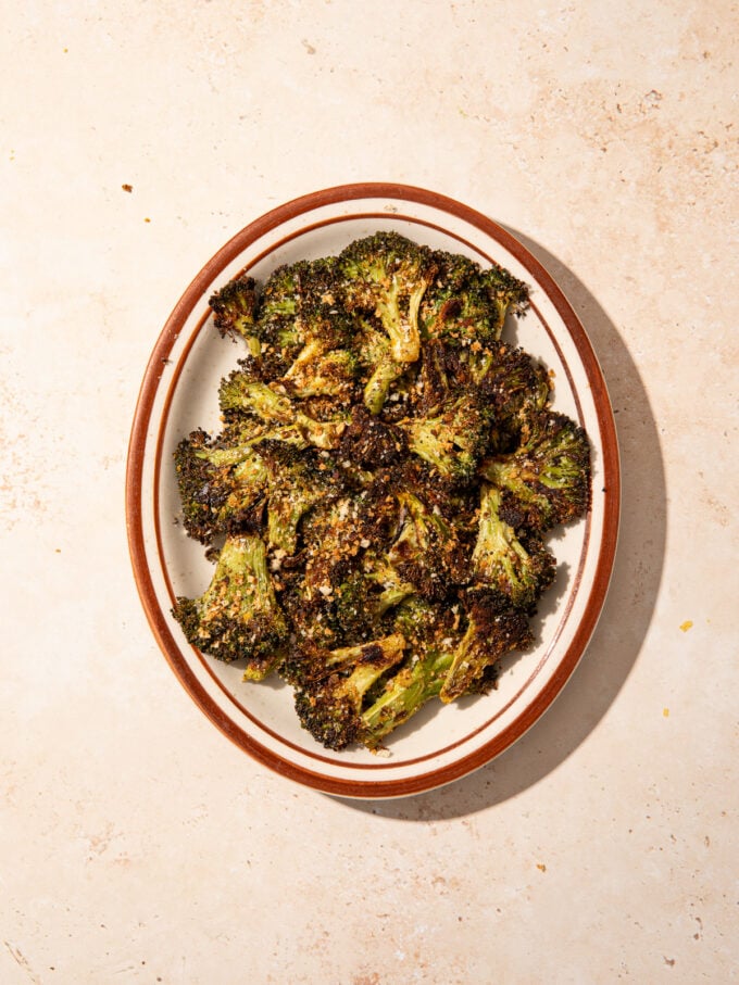 smashed broccoli on brown plate