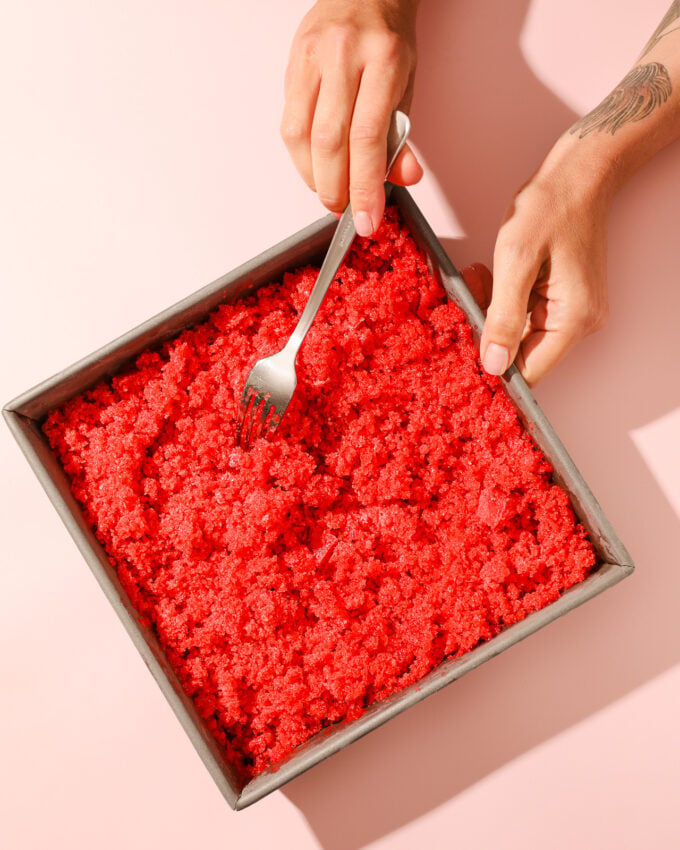 strawberry granita in pan with fork