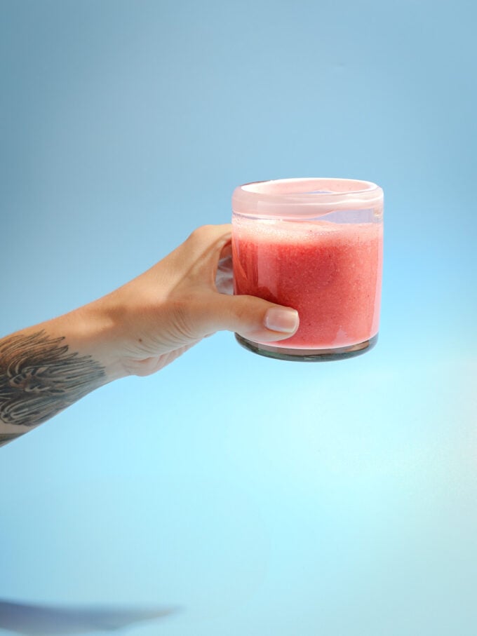 hand holding smoothie