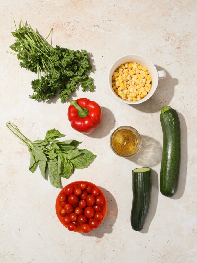 tomatoes, corn, parsley, basil, zucchini and cucumber