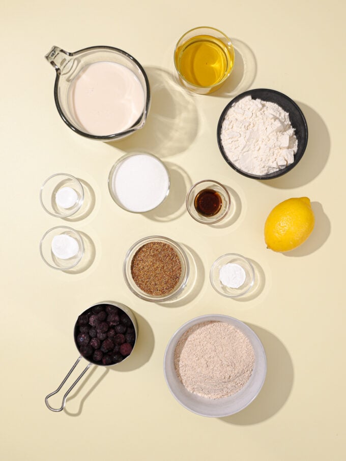 flour, soy milk and blueberries in bowls