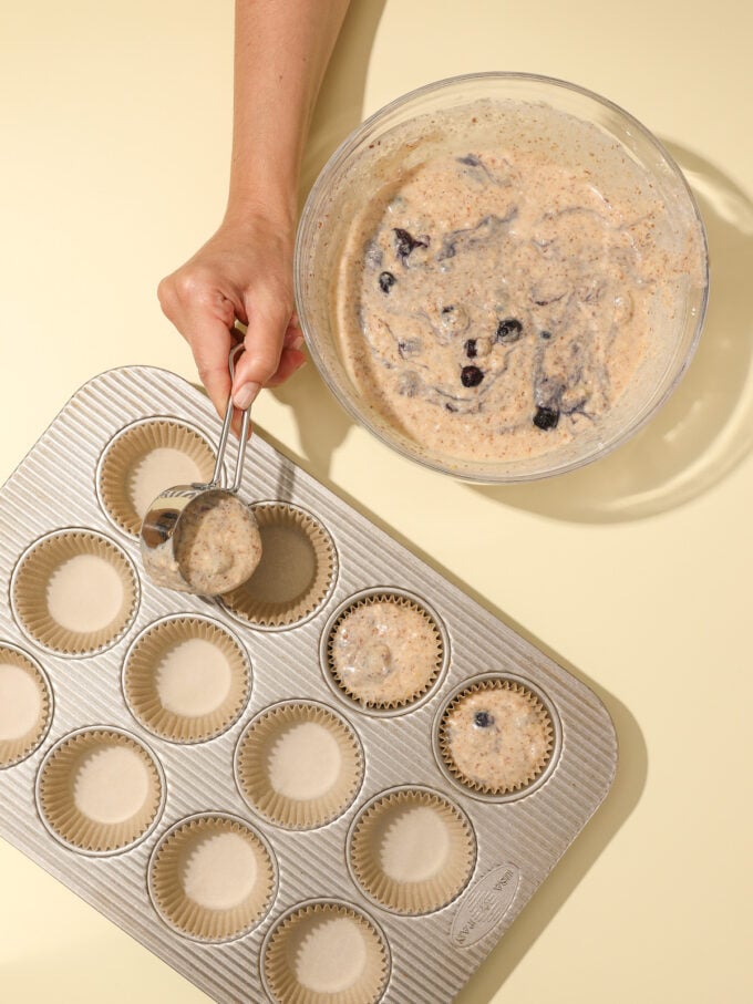 lemon blueberry muffin batter in muffin pan