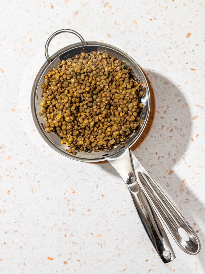 cooked lentils in sieve