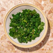 sautéed kale in a white bowl