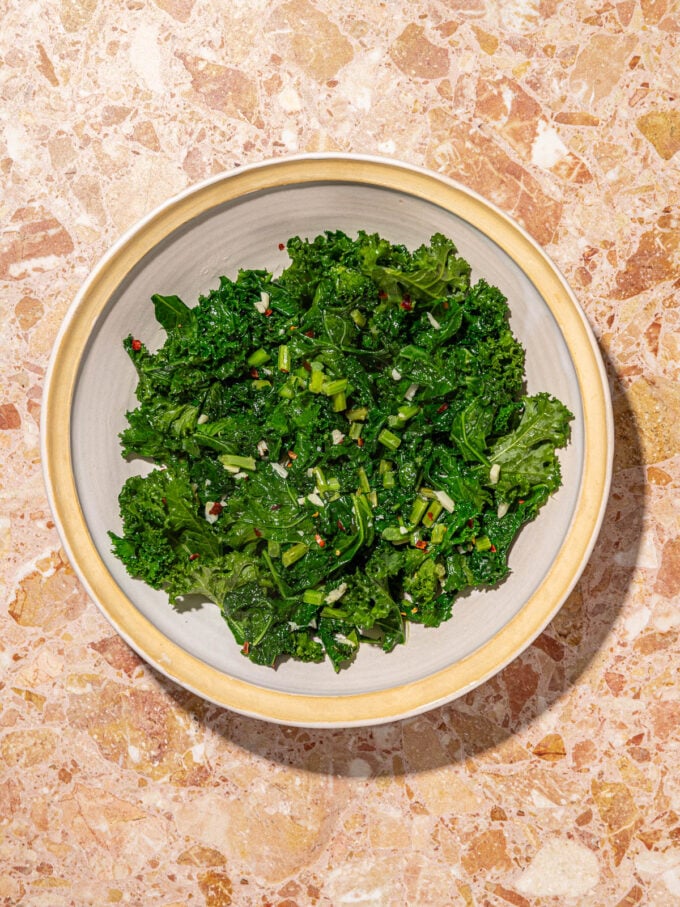 sautéed kale in a white bowl