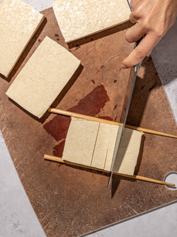 hand slicing tofu