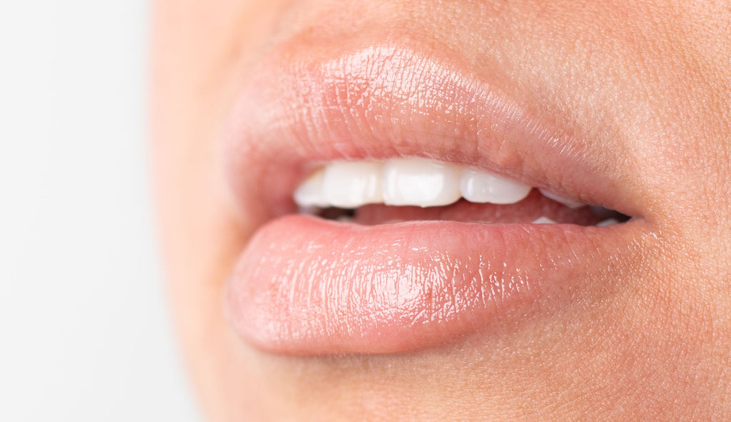 Woman with lip balm on