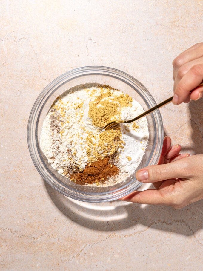 hand mixing flour and spices